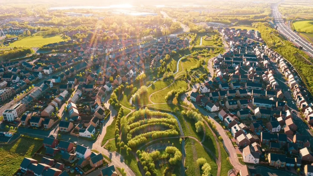Luchtfoto van een groeiende wijk, als beeld voor de groei van de Bordiva-gemeenschap